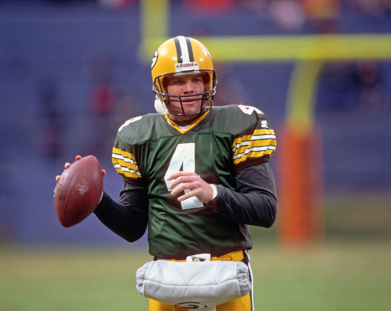 Quarterback Brett Favre of the Green Bay Packers looks on from the field.
