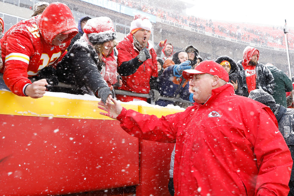 Head coach Andy Reid of the Kansas City Chiefs greets fans following their win over the Denver Broncos