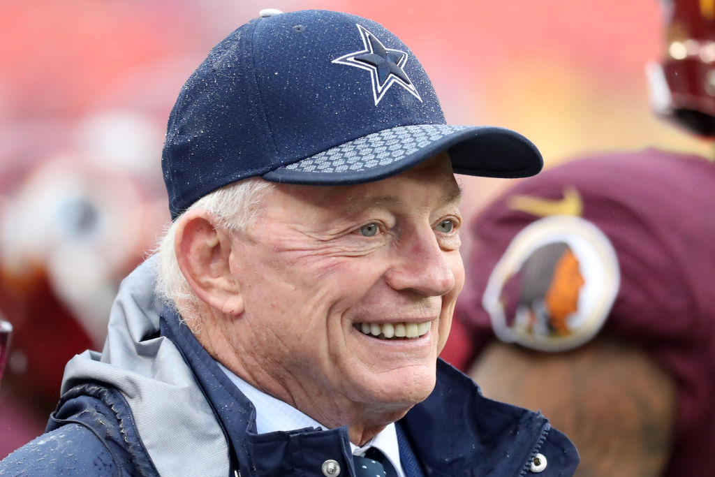 Jerry Jones watches players warm up before a Cowboys game