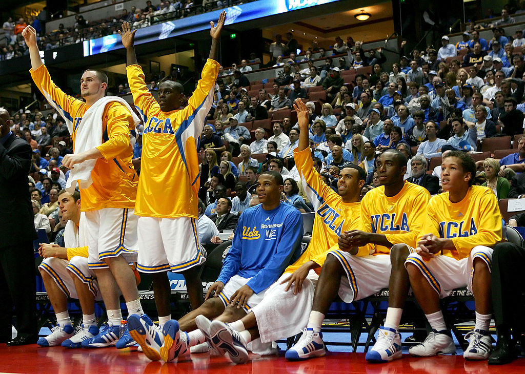 Kevin Love, Darren Collison, Russell Westbrook, Josh Shipp, and James Keefe of the UCLA Bruins celebrate on the bench in 2008