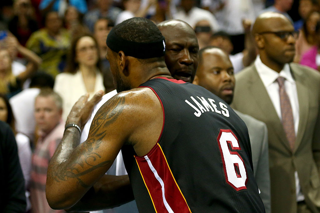 LeBron James of the Miami Heat hugs Michael Jordan