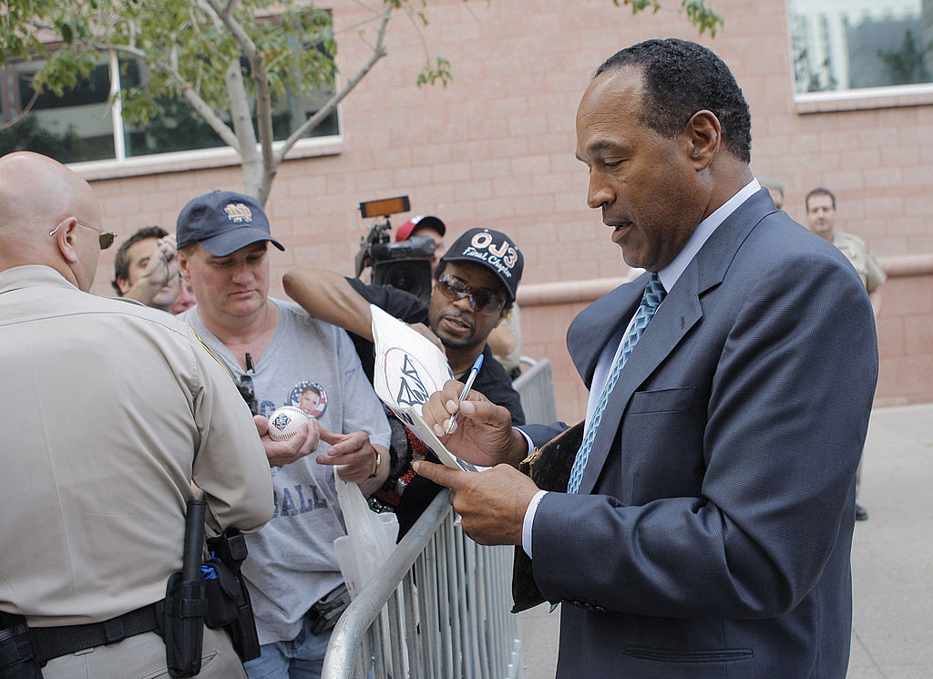 Where O.J. Simpson is now still involves signing autographs for fans, like he's doing here as he leaves the Clark County Regional Justice Center in 2008.