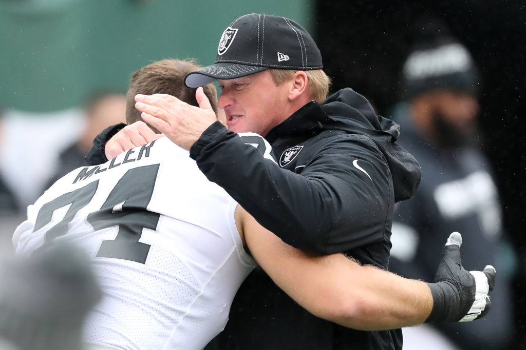 Oakland Raiders head coach Jon Gruden hugs offensive tackle Kolton Miller