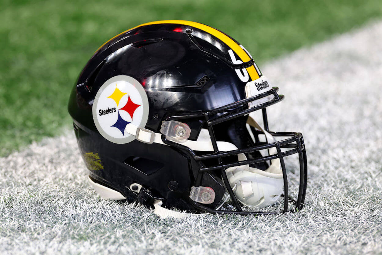 A Pittsburgh Steelers helmet on the grass.