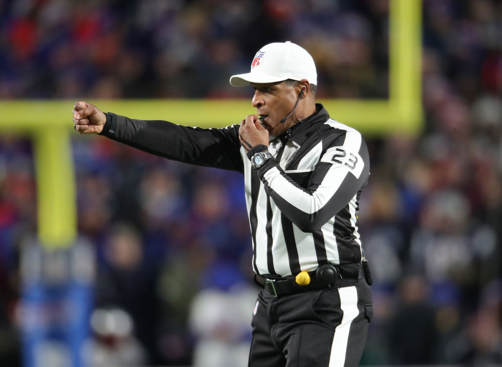 Referee Jerome Boger signals a call during a New England Patriots game