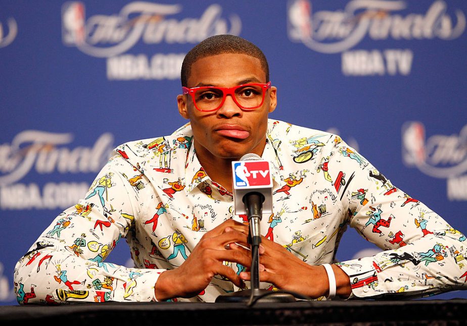 Famous NBA player/fashion icon Russell Wilson dressed up after a game.