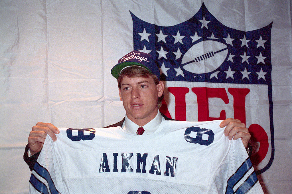 Troy Aikman holds up his jersey after being named the No. 1 draft pick by the Dallas Cowboys