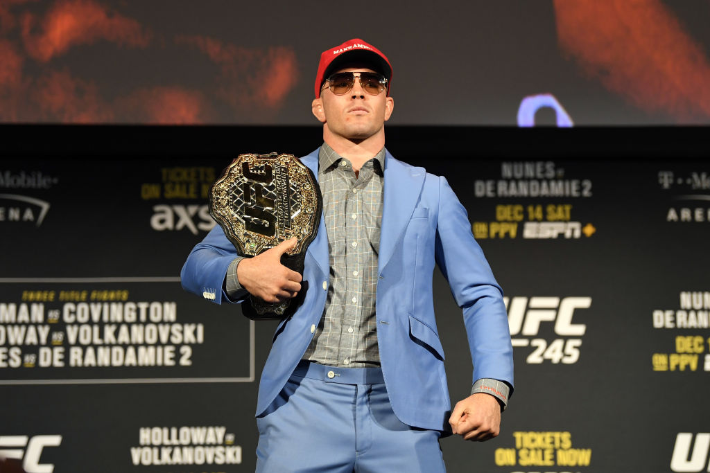 Colby Covington poses on stage during the UFC 245 press conference