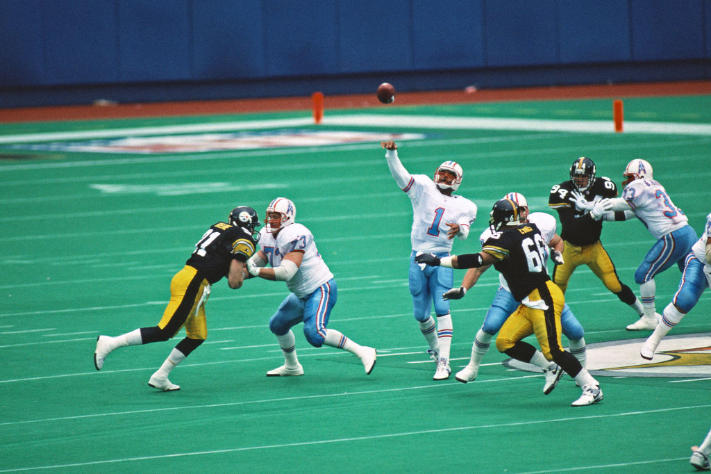 Hall of Fame NFL quarterback Warren Moon throws a pass.