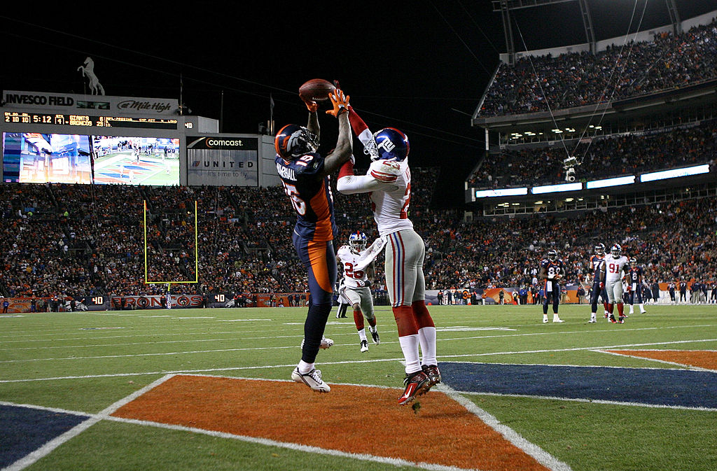 Corey Webster of the New York Giants breaks up a pass in the end zone intended for wide receiver Brandon Marshall of the Denver Broncos