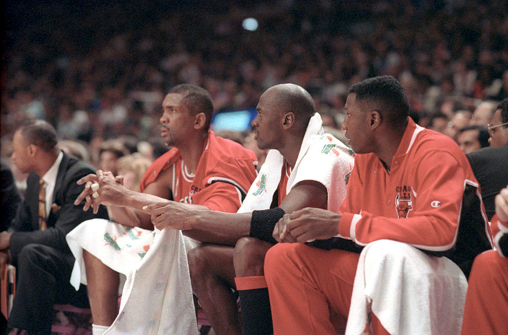 Bill Cartwright and Michael Jordan sit on the Chicago Bulls bench
