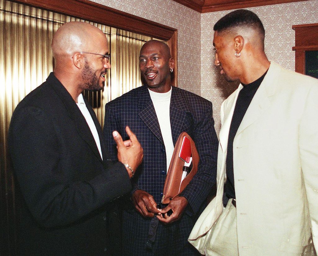 Chicago Bulls Michael Jordan (C), Scottie Pippen (R), and Ron Harper get together before a meeting