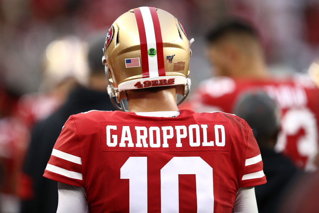 Jimmy Garoppolo of the San Francisco 49ers stands on the sidelines