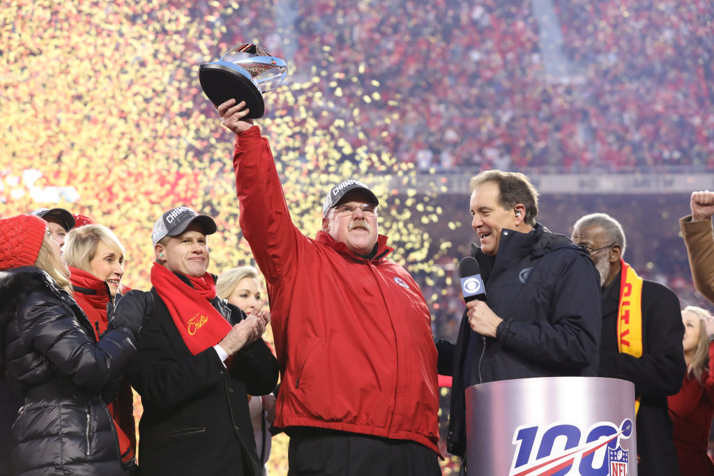 Kansas City Chiefs head coach Andy Reid lifts the Lamar Hunt Trophy over his head after the AFC Championship game