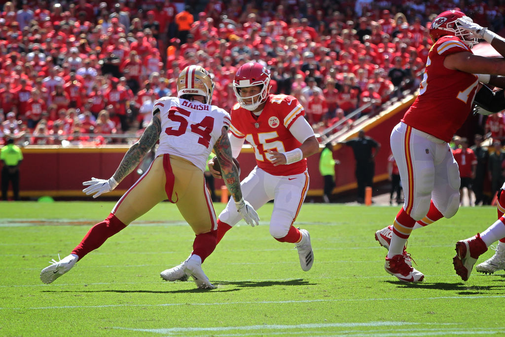 Kansas City Chiefs quarterback Patrick Mahomes takes a big hit from a 49ers defensive end in 2018