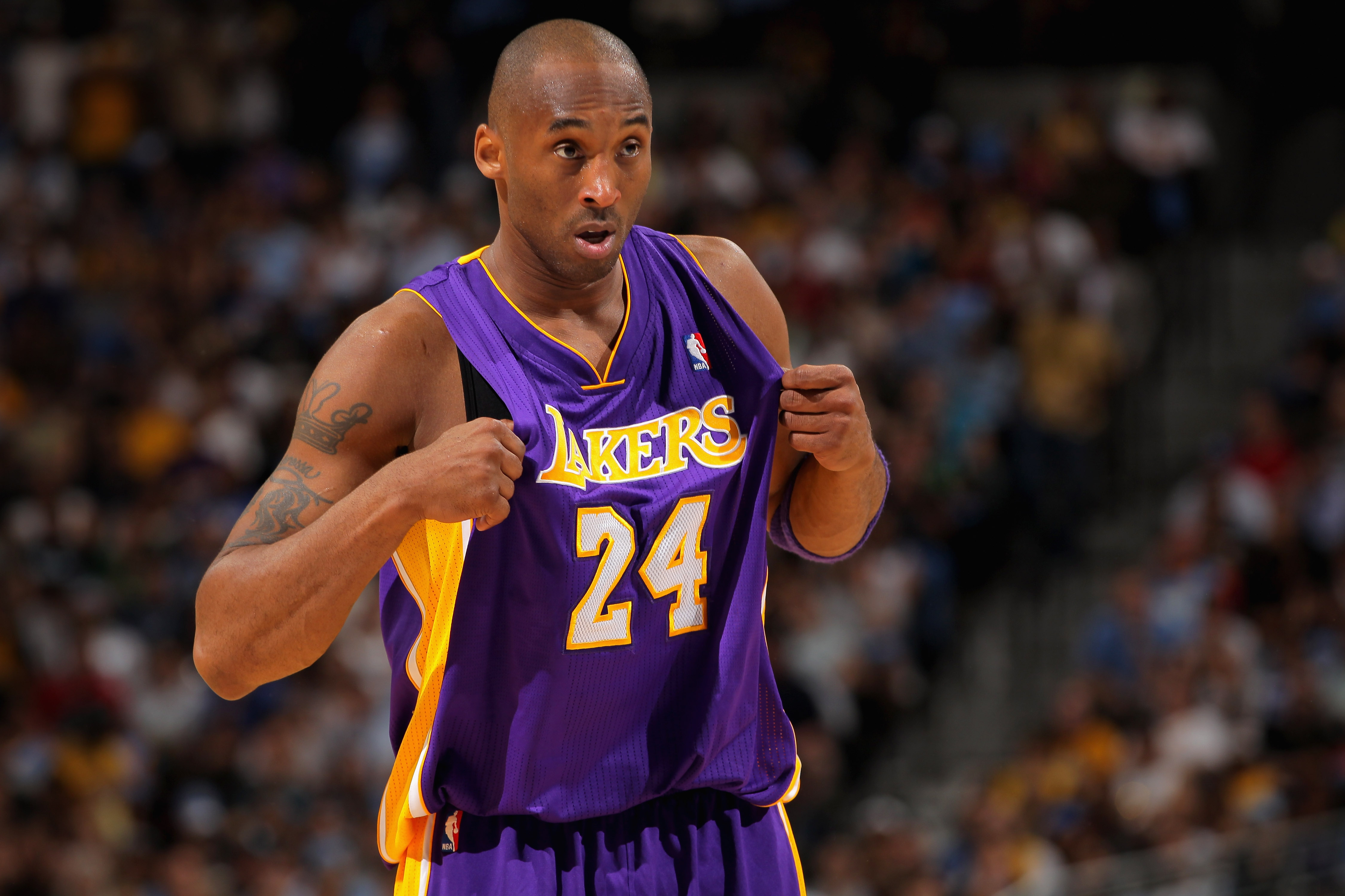 Kobe Bryant of the Los Angeles Lakers adjusts his jersey.