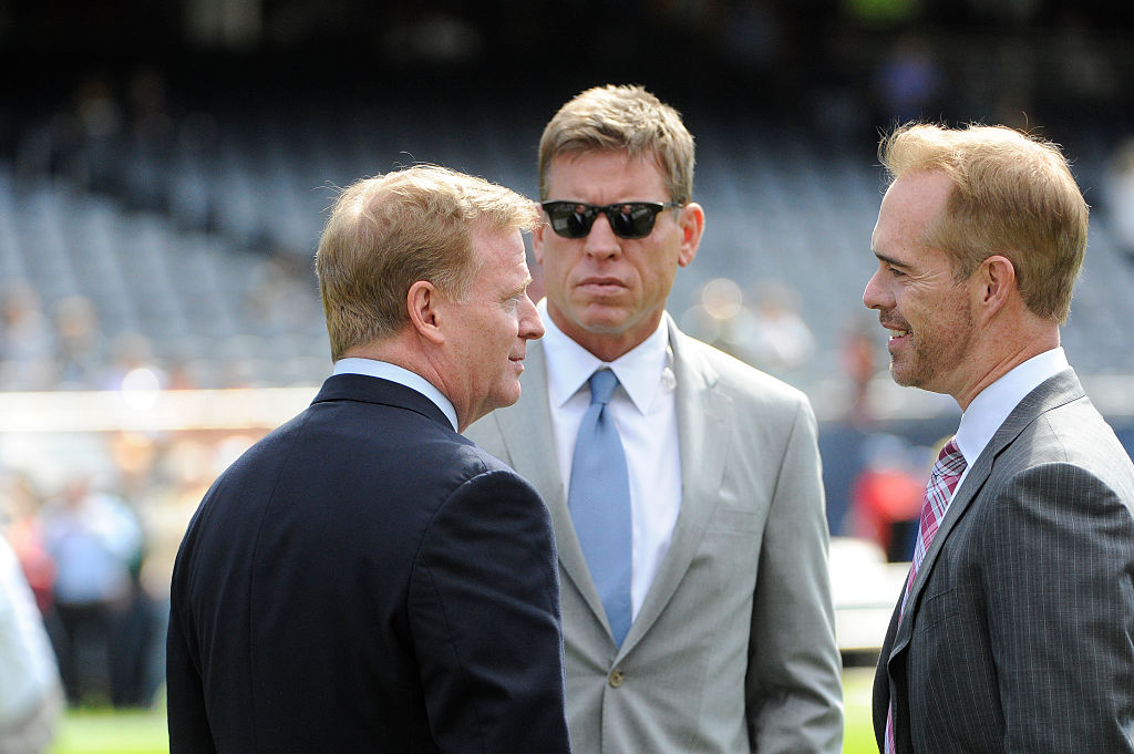 NFL Commissioner Roger Goodell (L) talks to Troy Aikman (C) and Joe Buck on the field