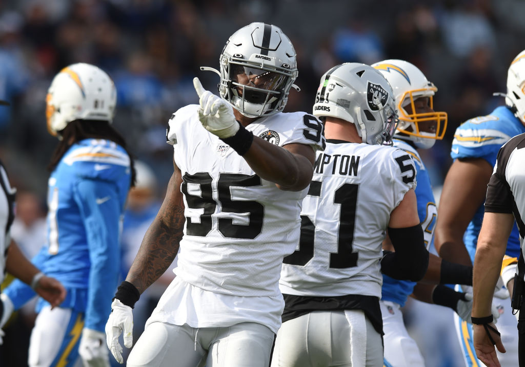 Oakland Raiders defensive end Dion Jordan (95) celebrates after a defensive stop during an NFL game in 2019