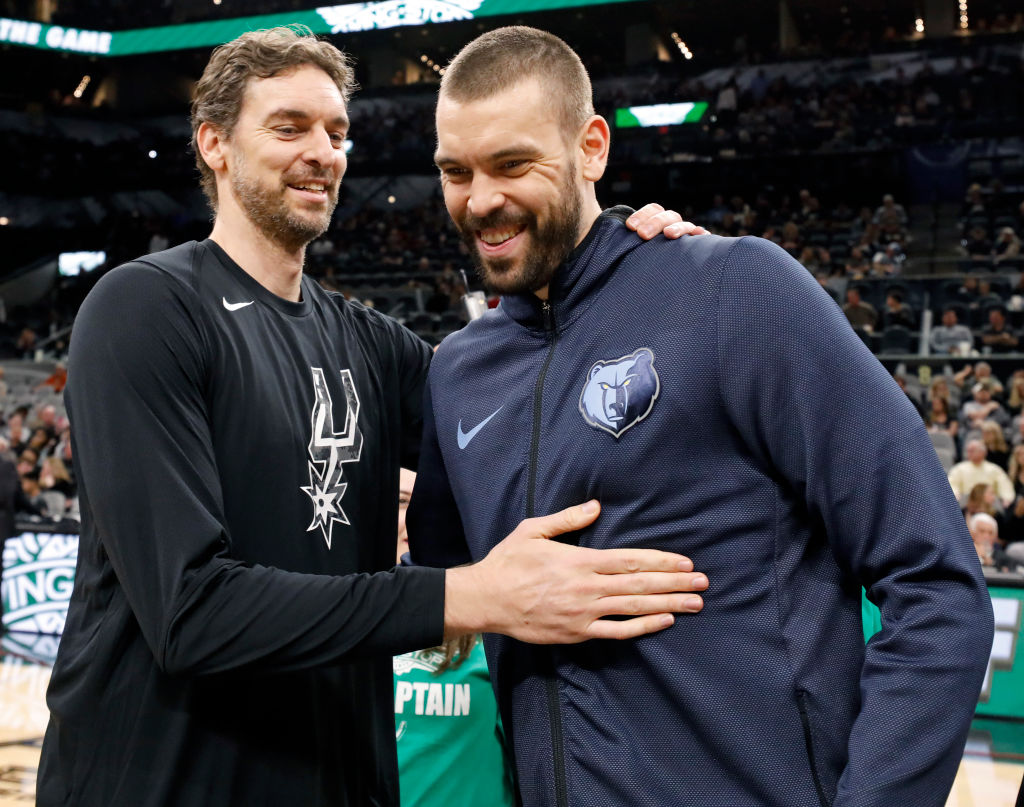 Pau Gasol of the San Antonio Spurs talks with his brother Marc Gasol of the Memphis Grizzlies
