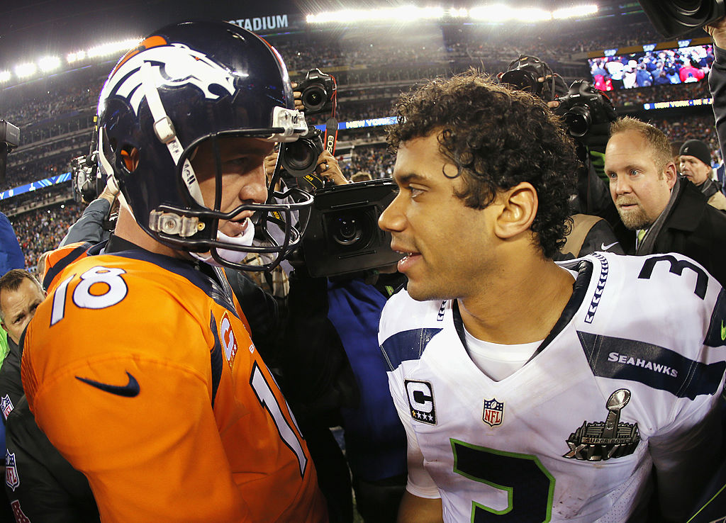 Quarterback Peyton Manning of the Denver Broncos congratulates quarterback Russell Wilson of the Seattle Seahawks after Super Bowl XLVIII