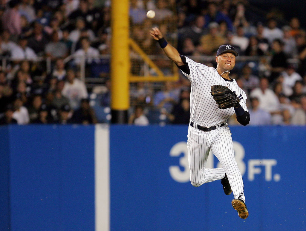 New York Yankees' shortstop Derek Jeter makes a leaping throw