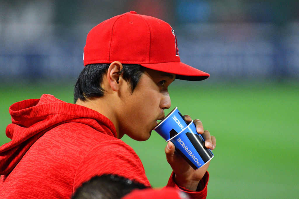 MLB player Shohei Ohtani spits into a cup