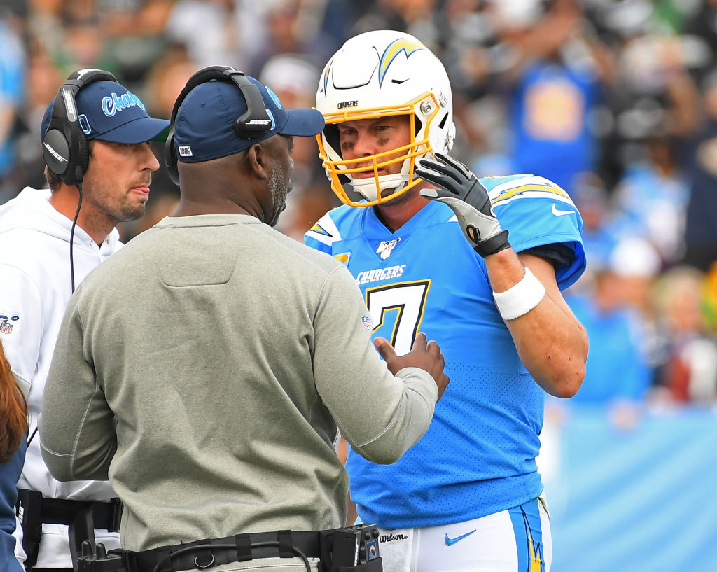 hilip Rivers and Anthony Lynn talk on the sideline