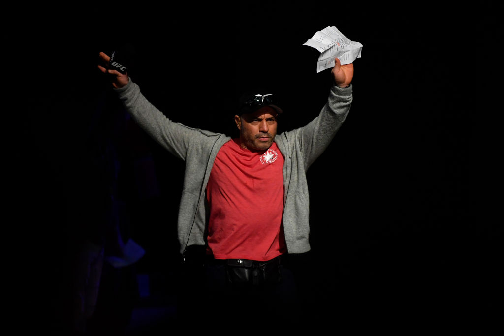 Joe Rogan walks on stage during the UFC 238 weigh-in