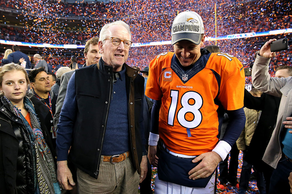 Archie Manning celebrates with Peyton Manning after the Denver Broncos won the AFC Championship Game. 