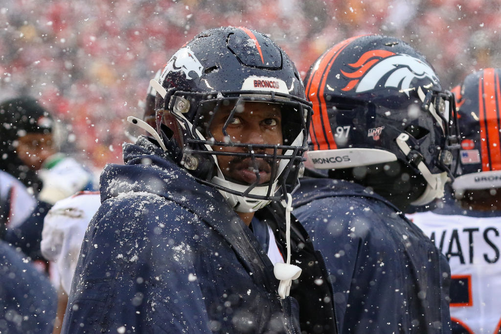 Denver Broncos outside linebacker Von Miller tries to stay warm on the bench