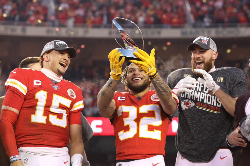 Chiefs quarterback Patrick Mahomes, safety Tyrann Mathieu, and tight end Travis Kelce with the Lamar Hunt Trophy after the AFC Championship