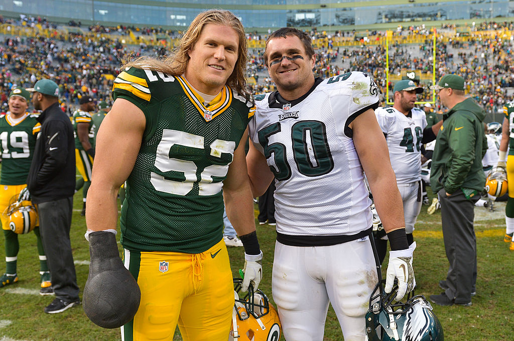Clay and Casey Matthews pose after playing against each other in a game