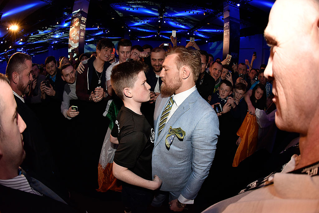UFC fighter Conor McGregor faces off with a young fan in 2015