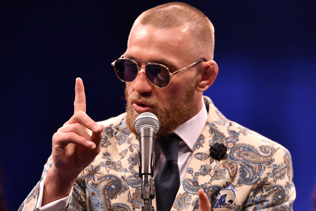 Conor McGregor speaks to the media during a news conference after Mayweather's 10th-round TKO victory in their super welterweight boxing match
