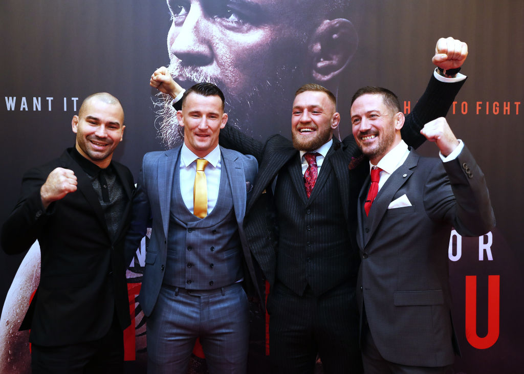 Conor McGregor with head coach John Kavanagh (R), MMA fighter Artem Lovov (L), and coach Owen Roddy at the Conor McGregor: Notorious premiere