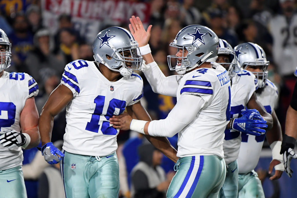 Amari Cooper of the Dallas Cowboys celebrates a 29-yard touchdown pass from Dak Prescott