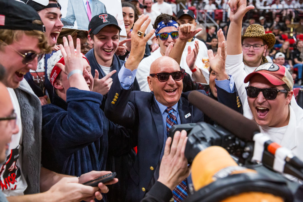 ESPN broadcaster Dick Vitale stands in the student section before a college basketball game