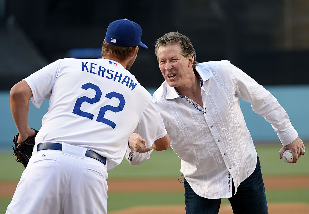 Former Los Angeles Dodgers pitcher Orel Hershiser gets a handshake from Clayton Kershaw