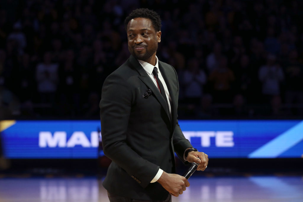 Former Marquette Golden Eagles player Dwyane Wade speaks to a crowd at Marquette