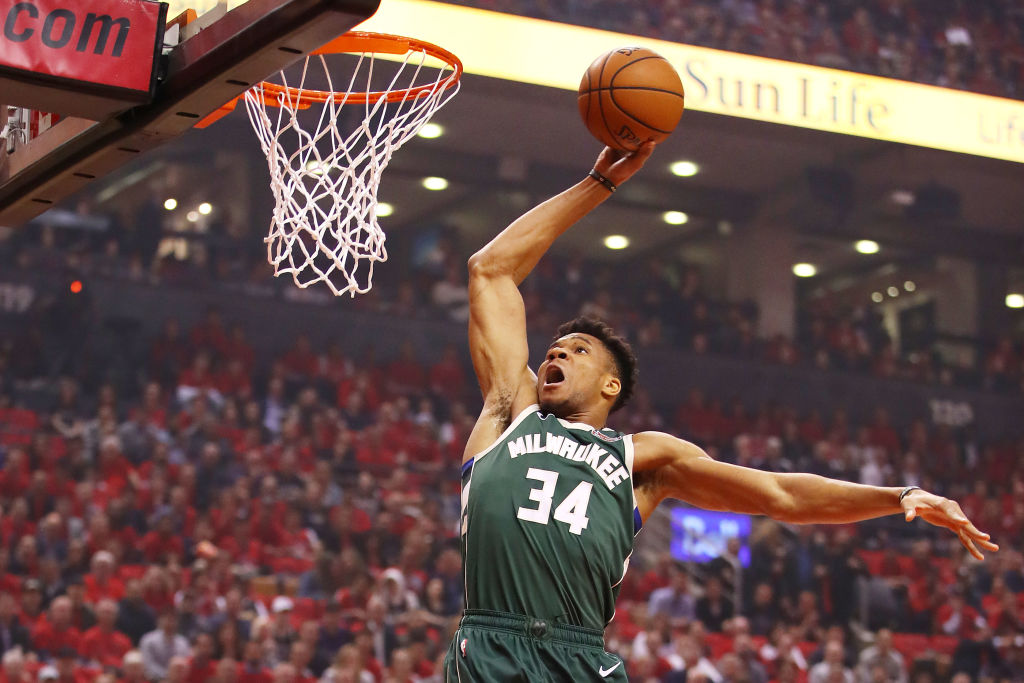 Giannis Antetokounmpo going up for a slam dunk