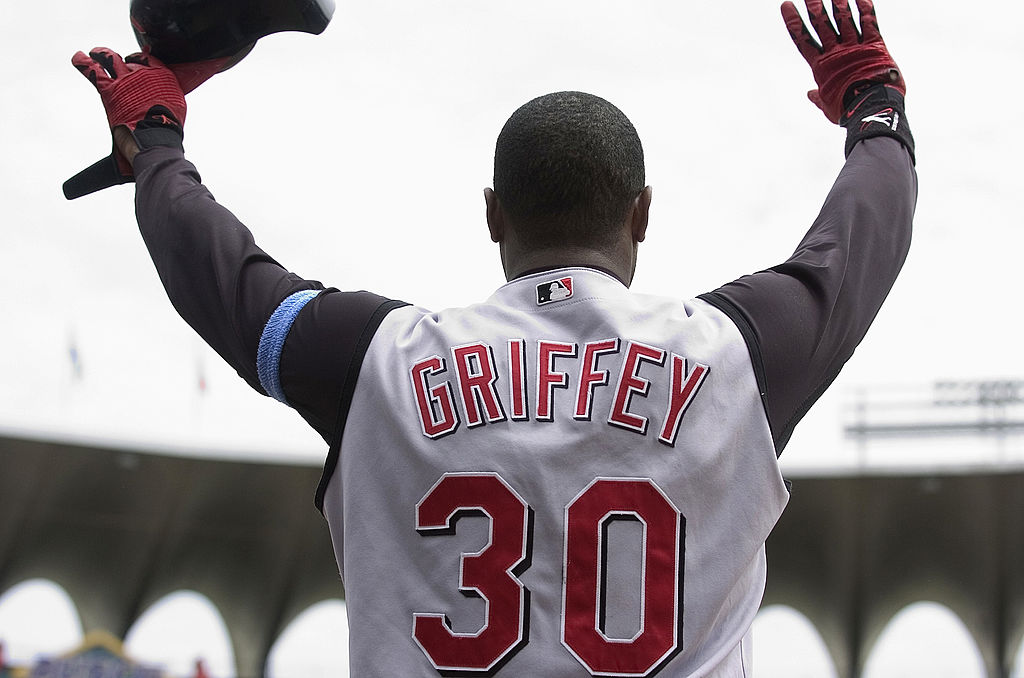 Ken Griffey Jr. celebrates as a Cincinnati Red after hitting his 500th career home run. 