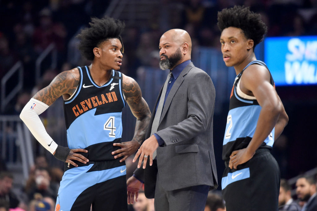Cleveland Cavaliers head coach J.B. Bickerstaff talks to rookie Kevin Porter Jr. during a game.