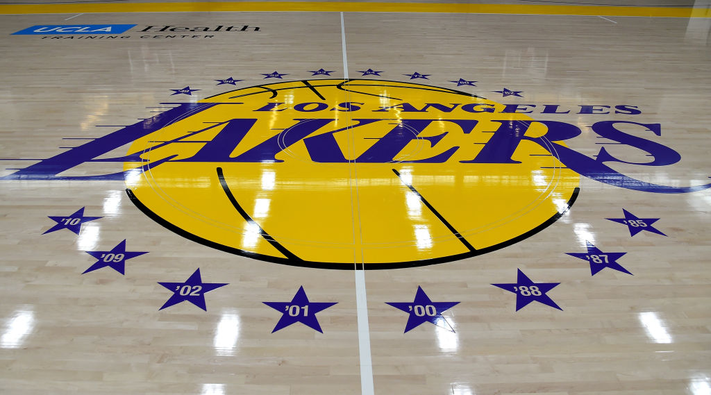 A Los Angeles Lakers logo on a basketball court
