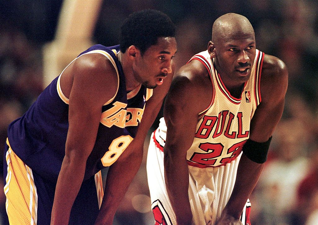 Los Angeles Lakers guard Kobe Bryant and Chicago Bulls guard Michael Jordan talk during a free-throw attempt