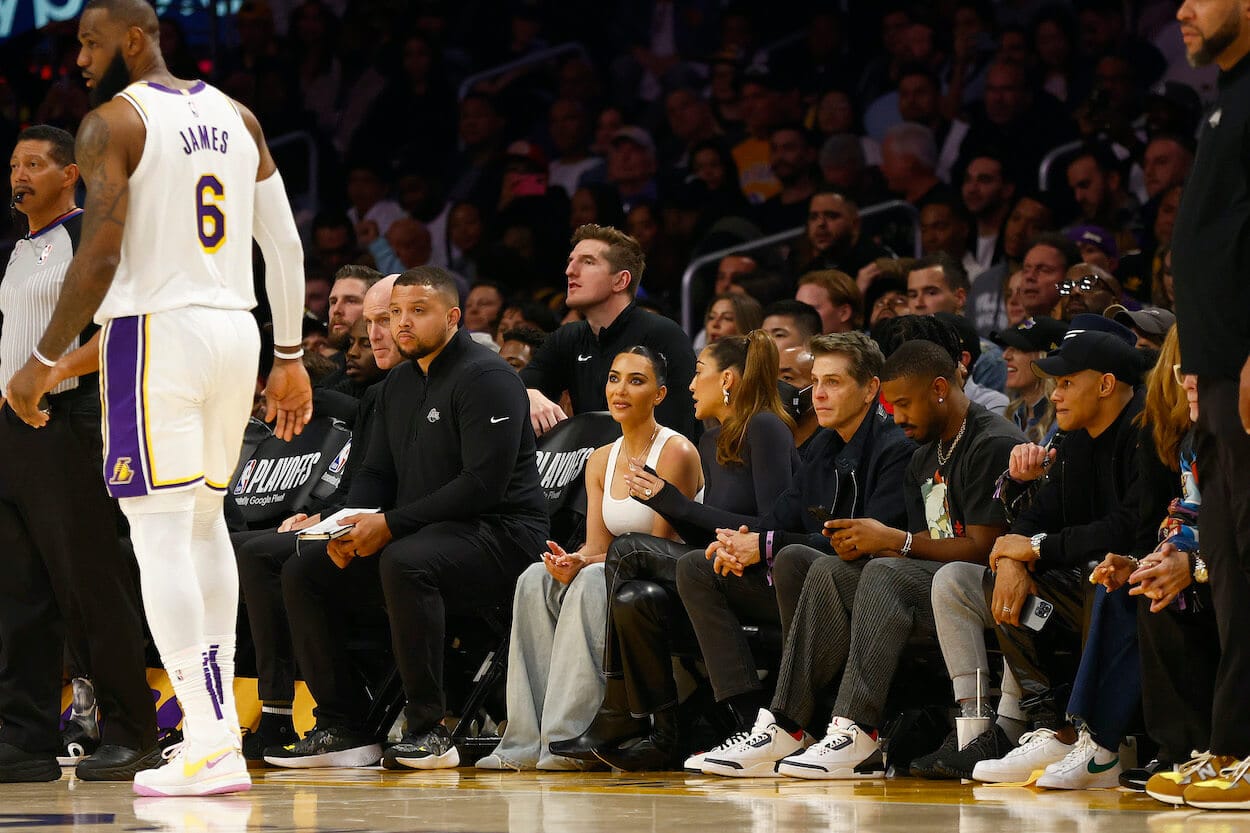 Kim Kardashian watches LeBron James from her courtside seats.