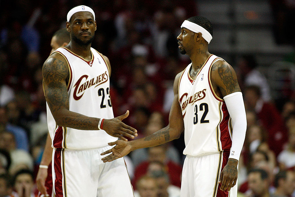LeBron James high fives Larry Hughes with the Cleveland Cavaliers.