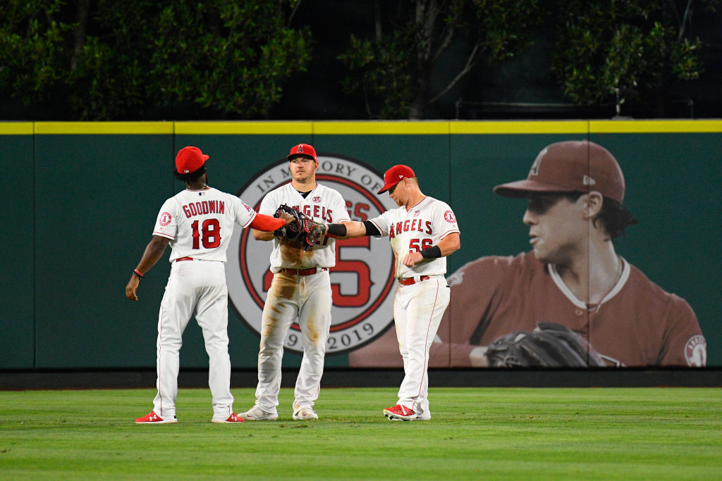 Los Angeles Angels Outfield Brian Goodwin, center fielder Mike Trout, and right fielder Kole Calhoun