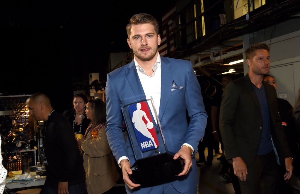 Luka Dončić holds the Eddie Gottlieb NBA Rookie of the Year award