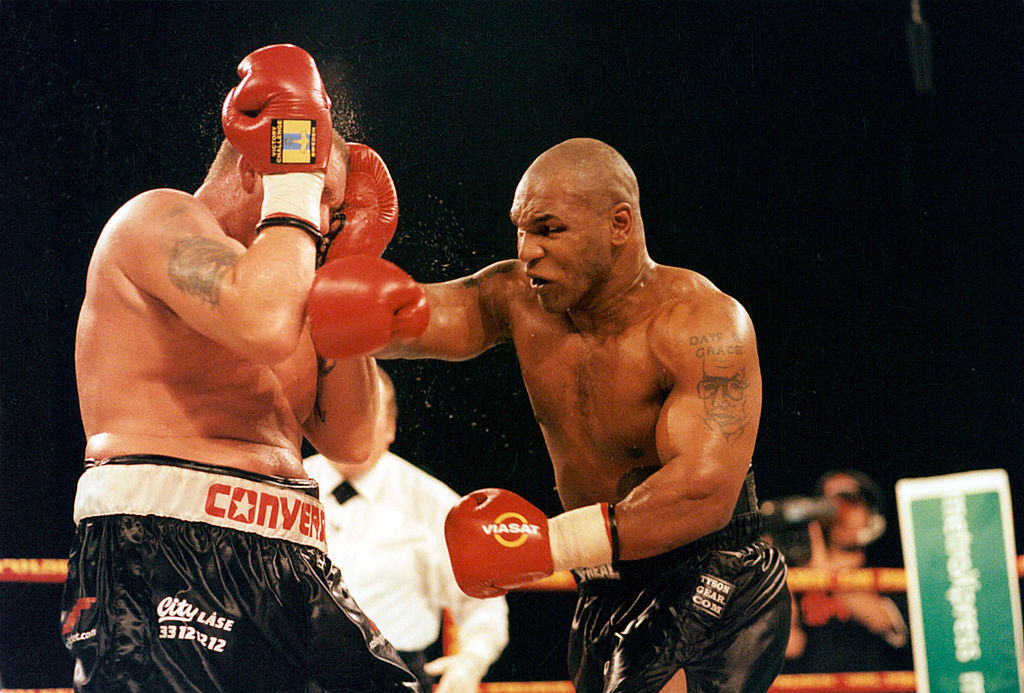 Mike Tyson throwing a punch during a boxing match