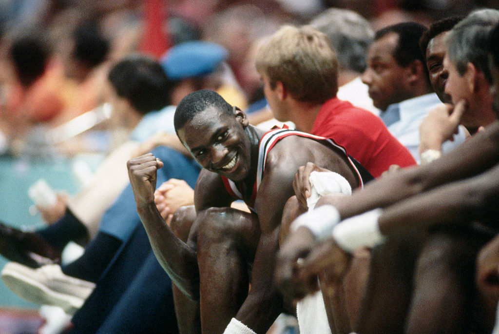NBA player Michael Jordan sits on the bench during the 1984 Olympics